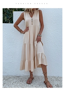 Detail of a beige V-neck sleeveless tiered midi dress with decorative front buttons