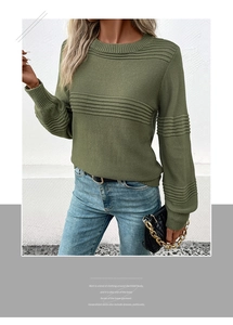 Detail view of olive green knit sweater with ribbed texture, crew neck and long lantern sleeves