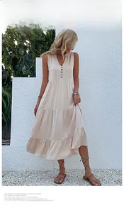 Detail of cream V-neck sleeveless maxi dress with button front in textured fabric