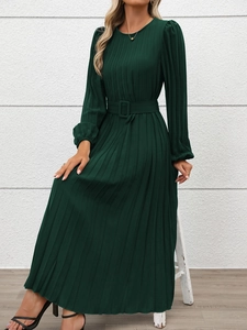 Detail of dark green pleated maxi dress featuring a matching square buckle waist belt