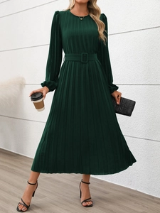 Detail of the elegant dark green pleated dress featuring a square buckle waist belt