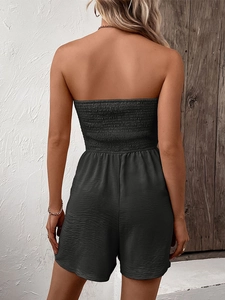 Detail showing the smocked elastic back and waist design of this dark gray strapless romper