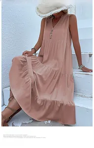 Detail of a pink V-neck tiered maxi dress with button accents and layered ruffle design