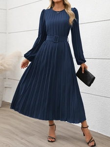Detail of navy long sleeve pleated dress with round neck and matching square buckle belt