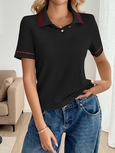 Detail of black rib-knit short sleeve polo shirt with striped collar and cuffs