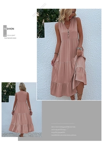 Detail view of tiered sleeveless V-neck summer dress in dusty pink with button accents