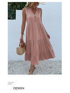 Detail of pink sleeveless V-neck maxi dress with tiered skirt and decorative buttons