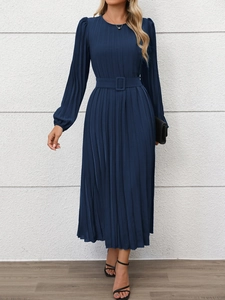 Detail view of navy blue pleated midi dress with cinched waist belt and long lantern sleeves