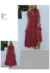 Detail of brick red V-neck maxi dress with wooden buttons and tiered skirt layers