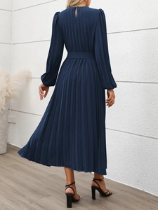 Detail of elegant dark blue long sleeve pleated maxi dress with waist belt and back closure