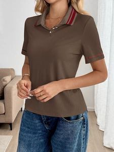 Close-up of ribbed texture and striped collar on a brown knit polo shirt for women