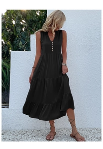 Detail of a black sleeveless V-neck maxi dress with buttons and tiered skirt