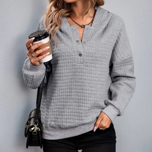 Grey textured quilted hoodie for women with henley button neck and loose drop shoulders