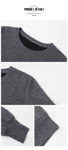 Detail of dark grey knit fabric featuring textured geometric and herringbone patterns