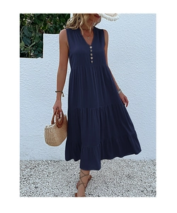 Detail of navy blue tiered sleeveless dress featuring V-neckline and wooden buttons