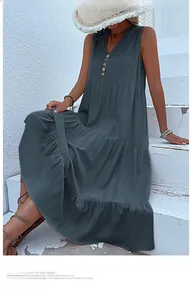 Detail of V-neck sleeveless tiered maxi dress with button accents and summer texture
