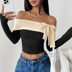 Off-shoulder long sleeve top with cream contrast trim and large shoulder bow detail