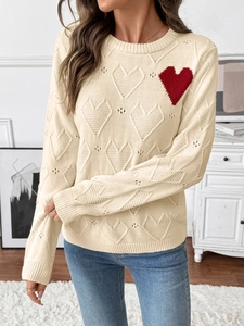 Beige crewneck knit sweater featuring red heart embroidery and textured heart patterns