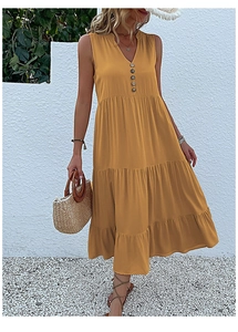 Detail of ginger yellow V-neck maxi dress featuring wooden buttons and layered skirt
