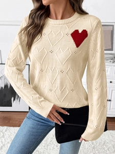Women's crewneck knit sweater in beige with red heart patch and hollow out texture