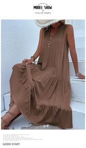 Close-up of dark brown V-neck tiered maxi dress with decorative wooden buttons