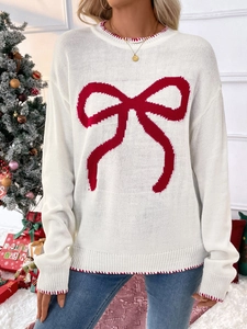 Women's festive cream knit sweater with red bow pattern and contrast stitching