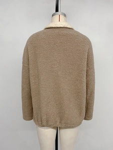 Back view of khaki sherpa fleece jacket with a cream high collar patchwork detail