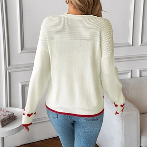 Back view of cream long sleeve knit sweater with red heart jacquard and striped trim