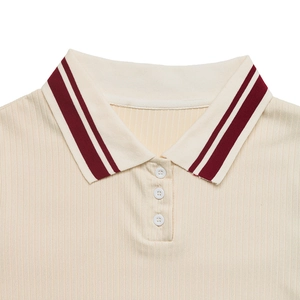Close-up of ribbed knit polo collar with red stripes and three-button placket detail