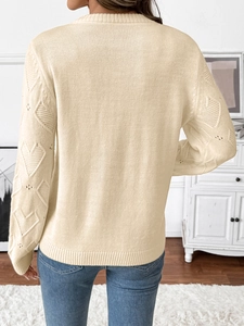 Women's cream crewneck sweater featuring hollow heart knit sleeves on a minimalist model