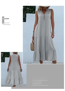 Detail view of V-neck tiered maxi dress with decorative wooden buttons and sleeveless cut