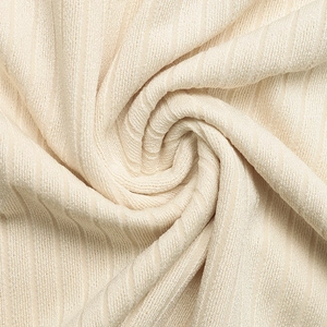 Detailed view of beige ribbed knit fabric showing soft texture and vertical stripe pattern