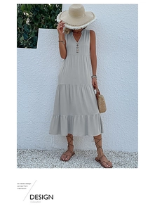 Detail of light gray tiered sleeveless maxi dress with V-neck and button accents