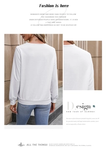 Detailed close-up of ribbed cuffs and hem on a white long-sleeved casual sweatshirt