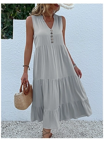 Detail of light grey V-neck tiered maxi dress with button front and loose fit fabric