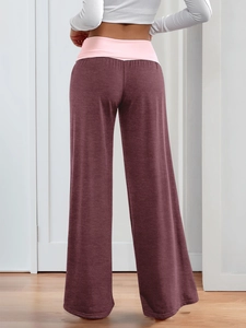 Rear view of burgundy wide-leg lounge pants with pink high-waist band and soft drape
