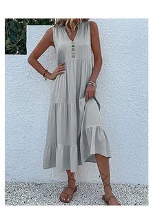 Detail of light blue sleeveless maxi dress with V-neck buttons and tiered cake skirt layer