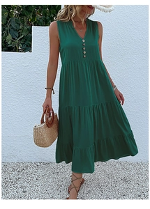Detail of dark green tiered summer dress with V-neckline and wooden button accents