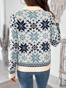 Back view of a knit Christmas sweater with blue Fair Isle snowflake patterns and ribbed trims