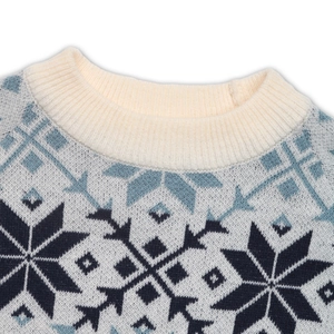 Macro detail of ribbed crew neck and Nordic snowflake knit patterns on sweater