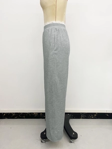 Side profile of grey high waist wide leg pants with elastic waistband and straight cut