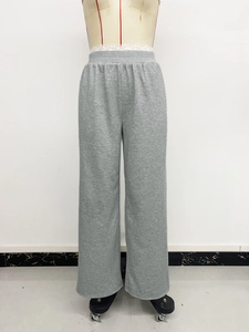 Detail showing elastic waist and soft cotton fabric of grey wide-leg lounge pants