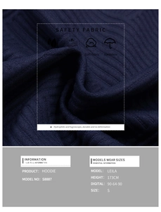 Detail of navy textured knit fabric on long sleeve sweatshirt showing vertical ribs