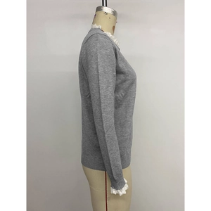 Grey long sleeve knit cardigan with white lace trim on collar and cuffs on mannequin