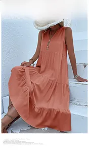 Detail of coral V-neck tiered maxi dress with decorative buttons for summer vacation