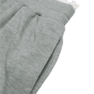 Detail of grey marl cotton wide leg pants featuring elastic ribbed waistband and side pockets
