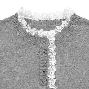 Grey knit sweater with white lace trim and round neck featuring matching grey buttons