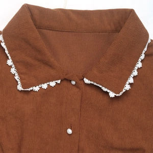Elegant brown corduroy long sleeve dress featuring lace trim collar and pearl buttons
