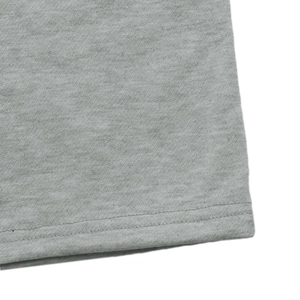 Macro shot of heather grey knit fabric showing high-quality double-needle hem stitching