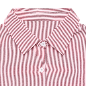 Close-up of red and white striped shirt collar with white button and fine fabric texture